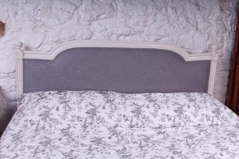 Carved frame newly upholstered French Empire style king size bed View III