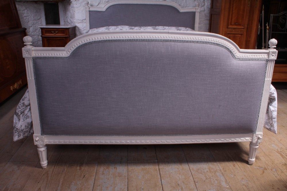 Carved frame newly upholstered French Empire style king size bed View IV