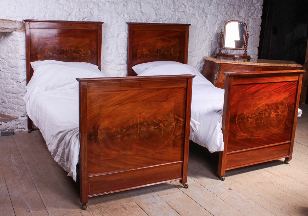 Lovely pair of walnut single beds with inlay detail