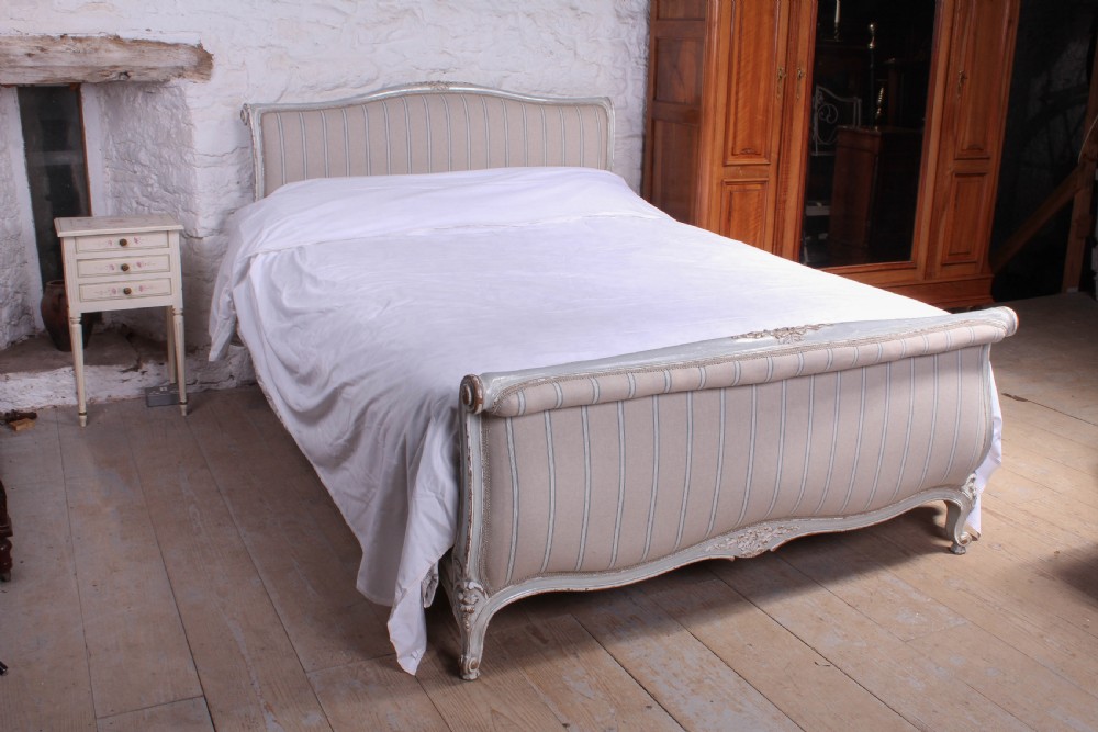 Newly upholstered Lit bateau style king size bed