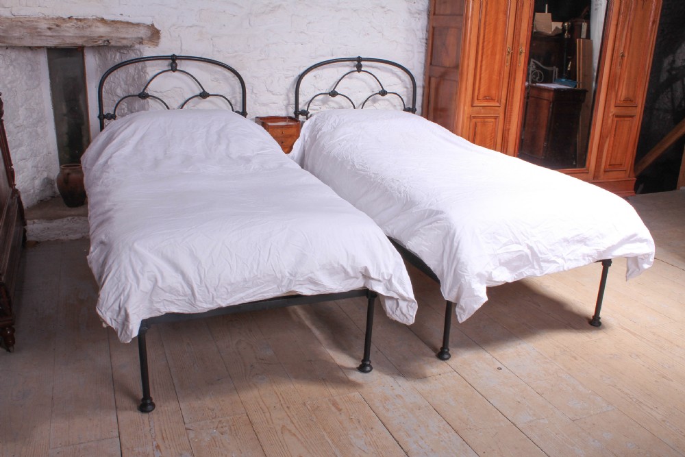 Attractive pair of black Irish iron single beds (can be joined)