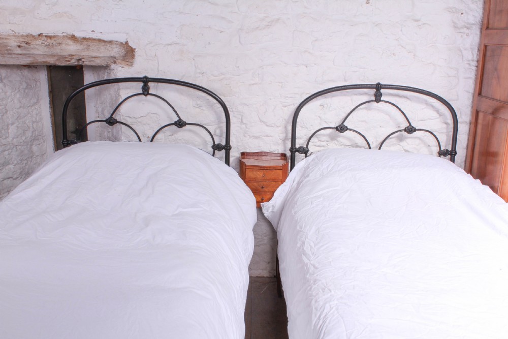 Attractive pair of black Irish iron single beds (can be joined) View IV