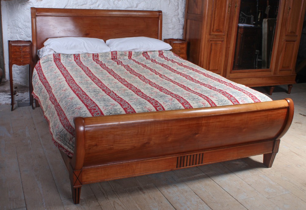 Individual and unusual cherry king size sleigh bed