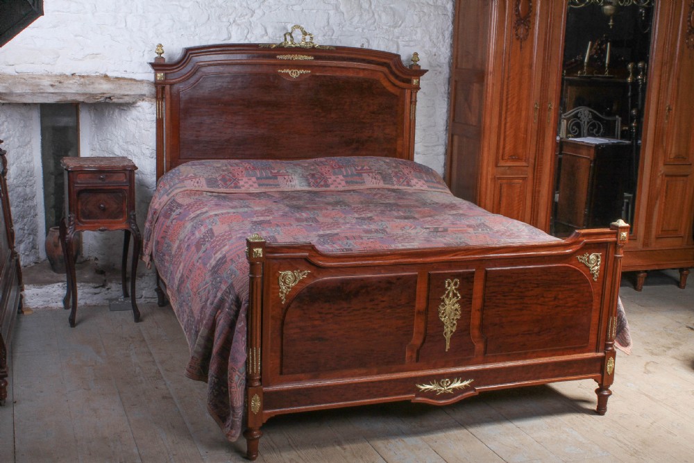 Striking French mahogany king size bed with gilded mounts