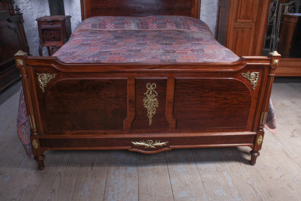 Striking French mahogany king size bed with gilded mounts View II