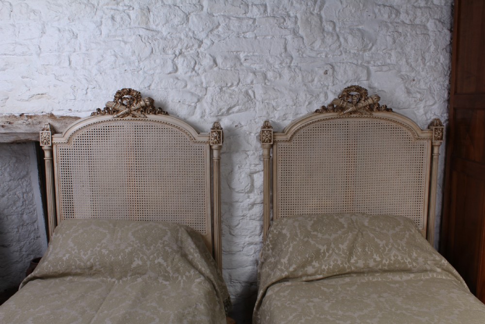 Striking pair of French Empire style caned single beds View IV