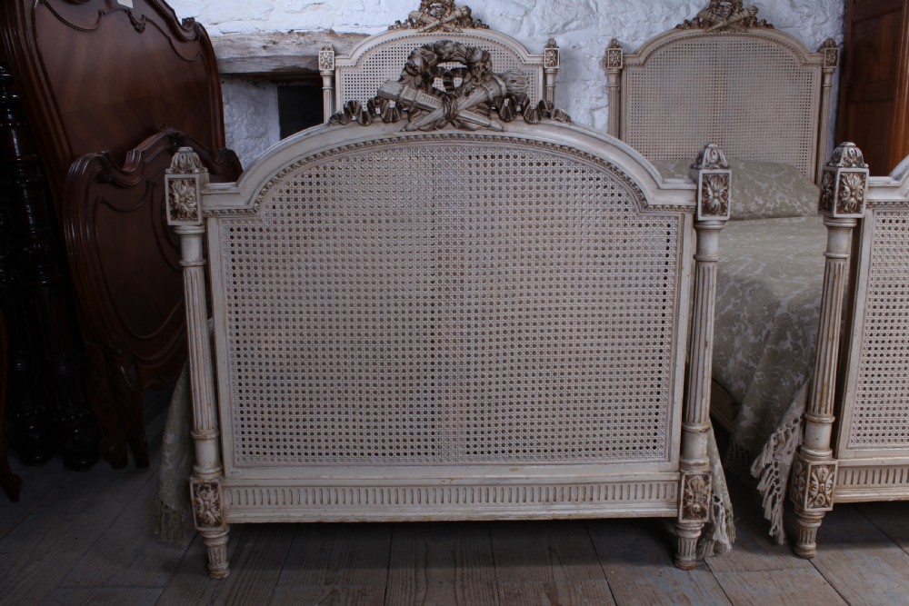 Striking pair of French Empire style caned single beds View VI