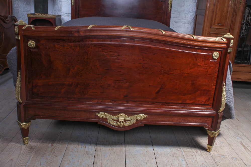 Magnificent Louis XV1 style bed with flame mahogany panels View II
