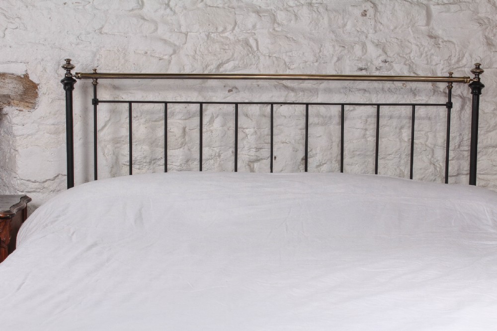 Pleasingly simple early Victorian brass and iron king size bed with forged iron panel View III