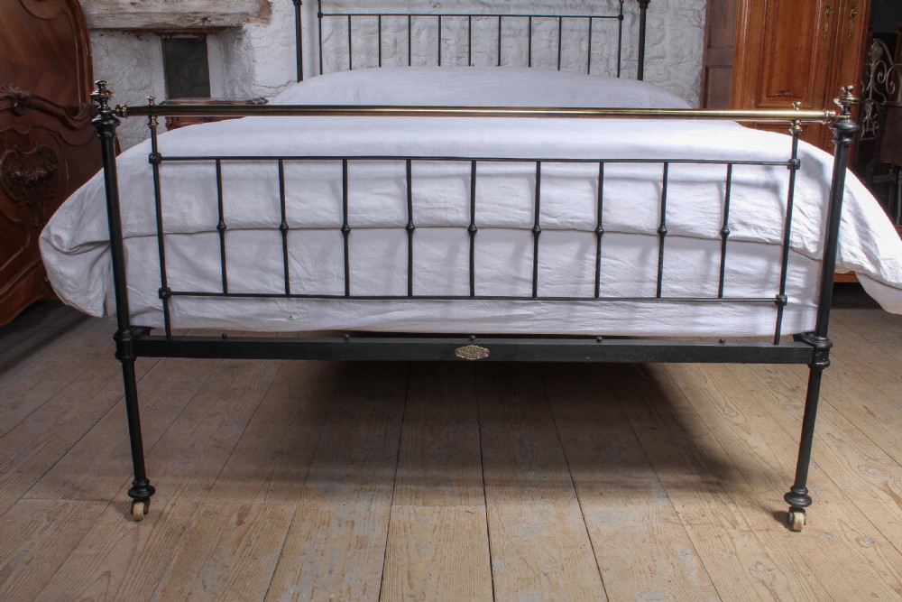 Pleasingly simple early Victorian brass and iron king size bed with forged iron panel View VI
