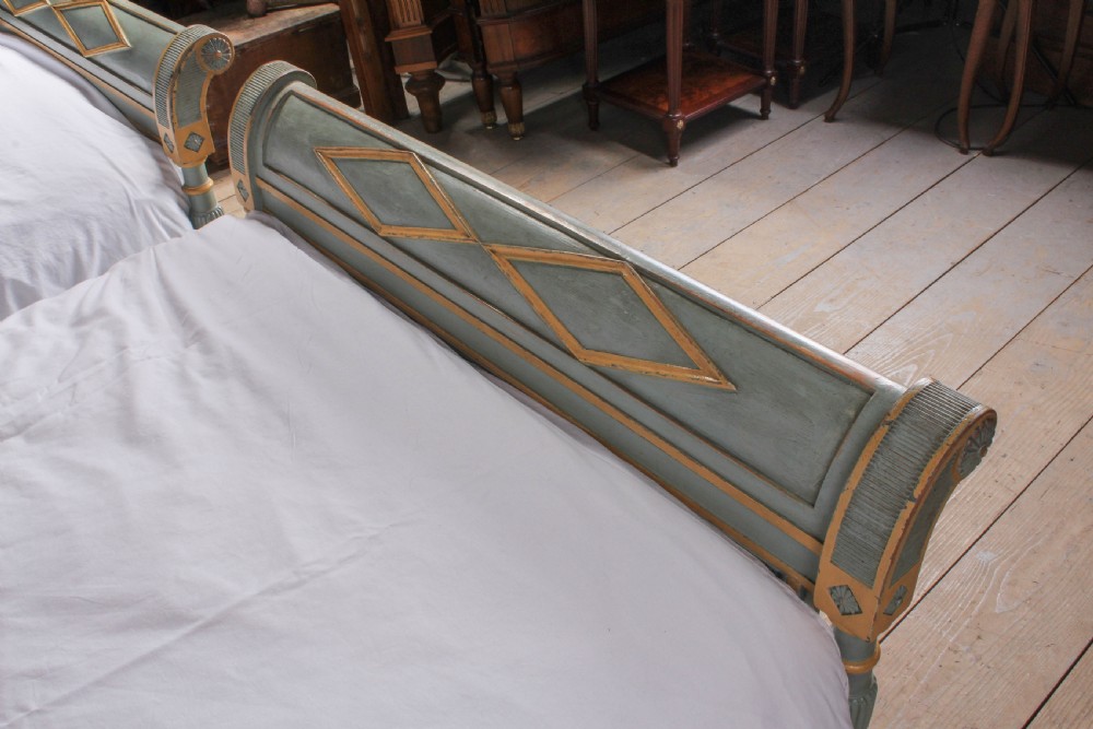 Matching pair of painted French Directoire single beds View V