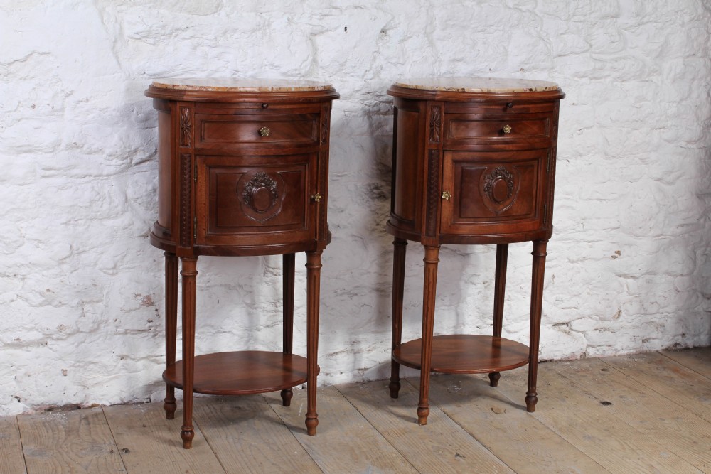 Beautiful pair of rare oval walnut bedsides