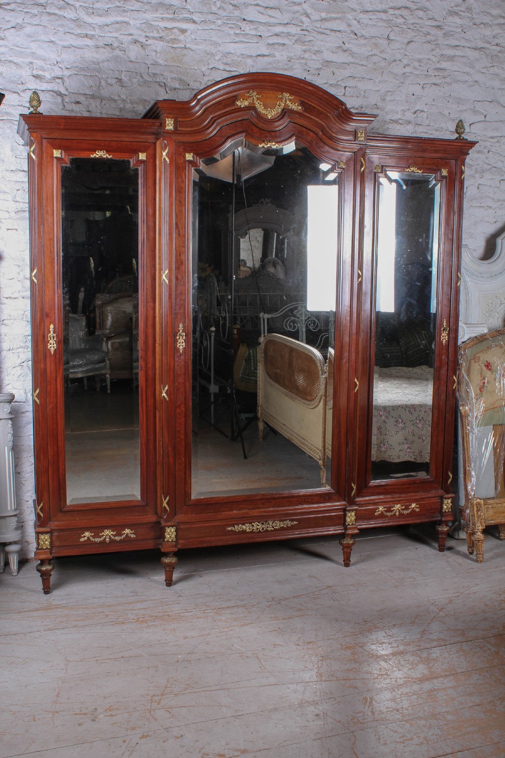 Exceptional solid French mahogany and fruit wood three door bedroom suite.