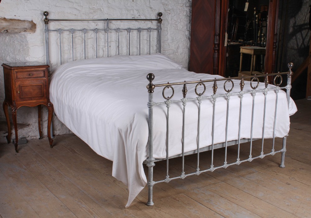 Pretty French king size bed with rings and spindles