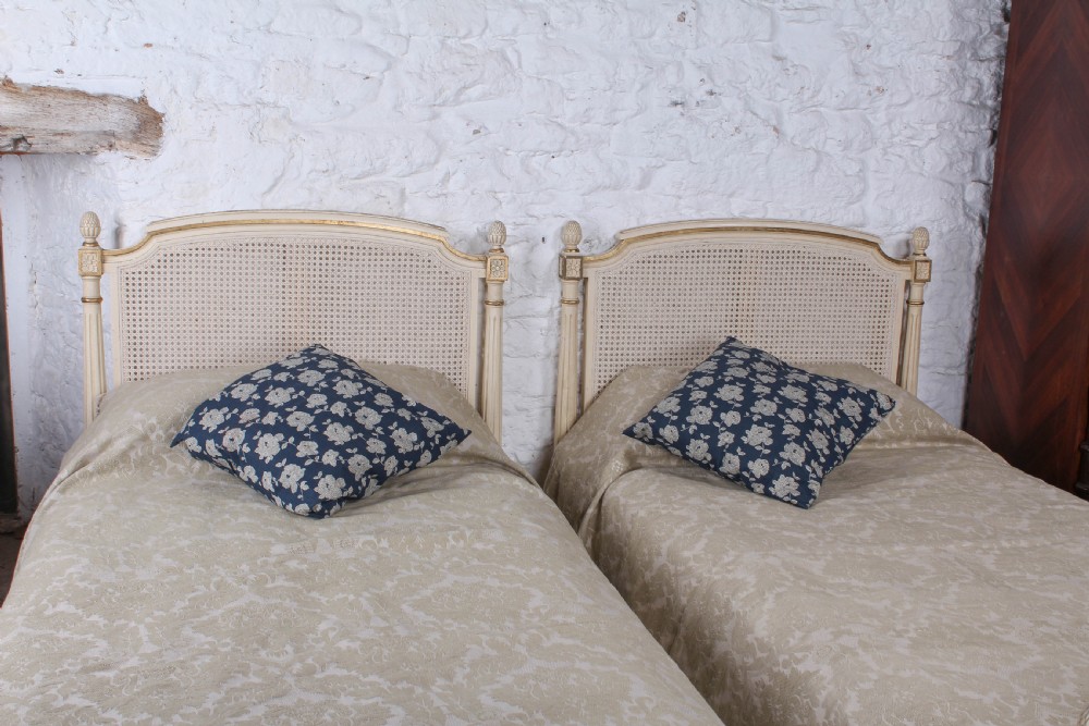 Pretty pair of French painted caned single beds View V