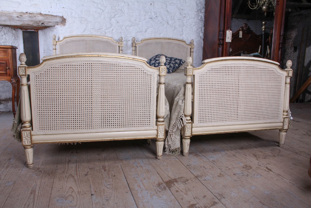 Pretty pair of French painted caned single beds View VI