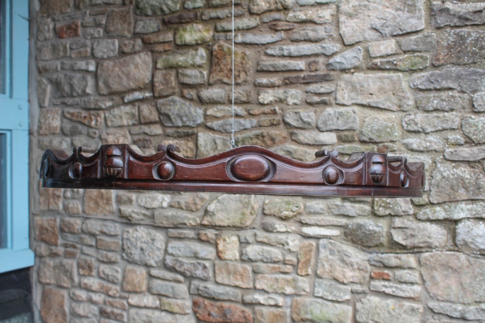 Circular mahogany ciel de lit with carved detail