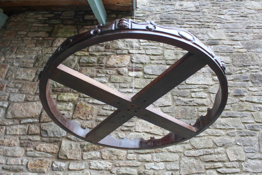 Circular mahogany ciel de lit with carved detail View II