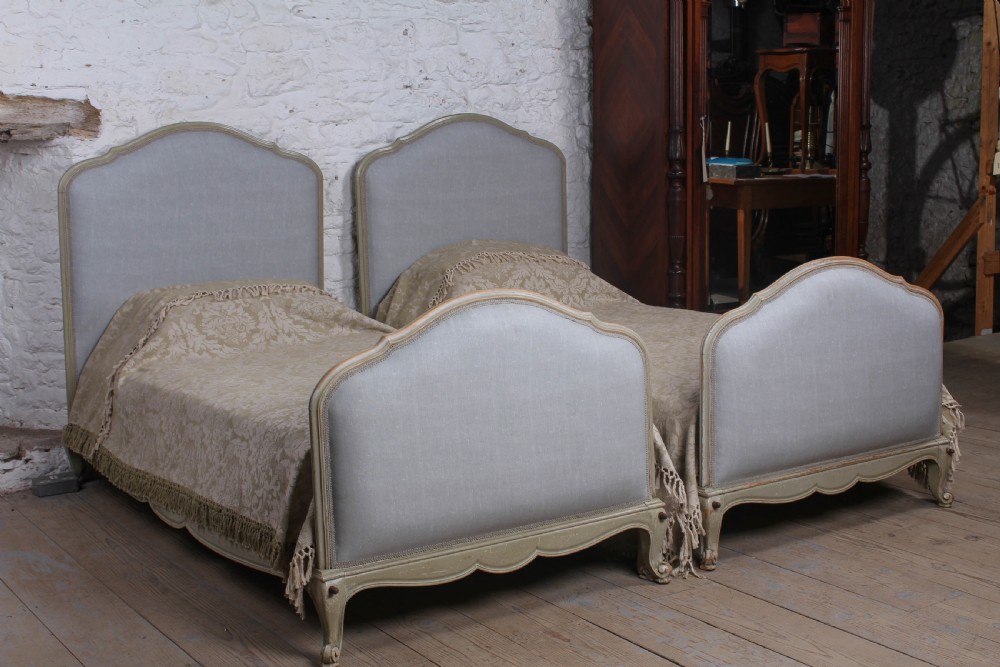 Nice pair of painted upholstered Louis XV style single beds