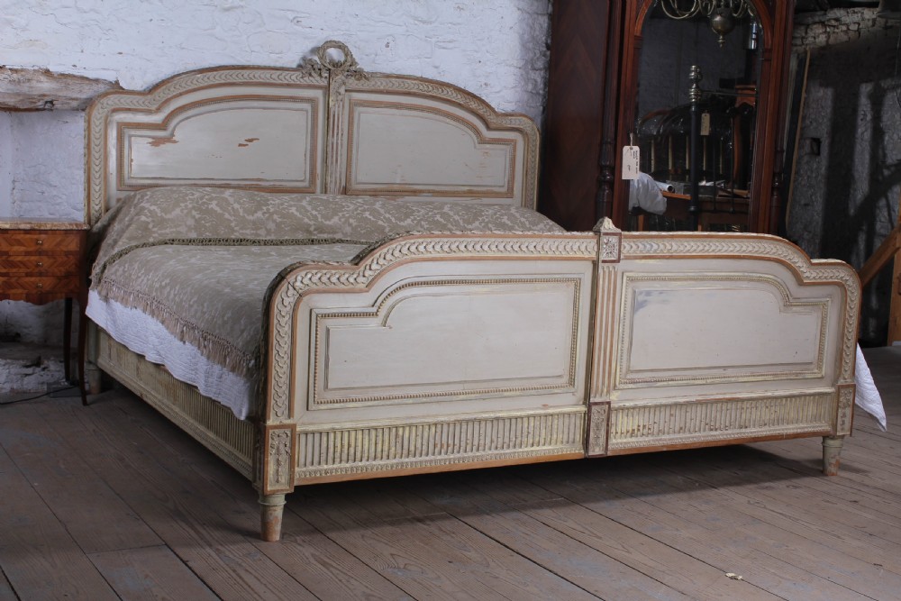 Spectacular Empire size original French carved painted joined bed.