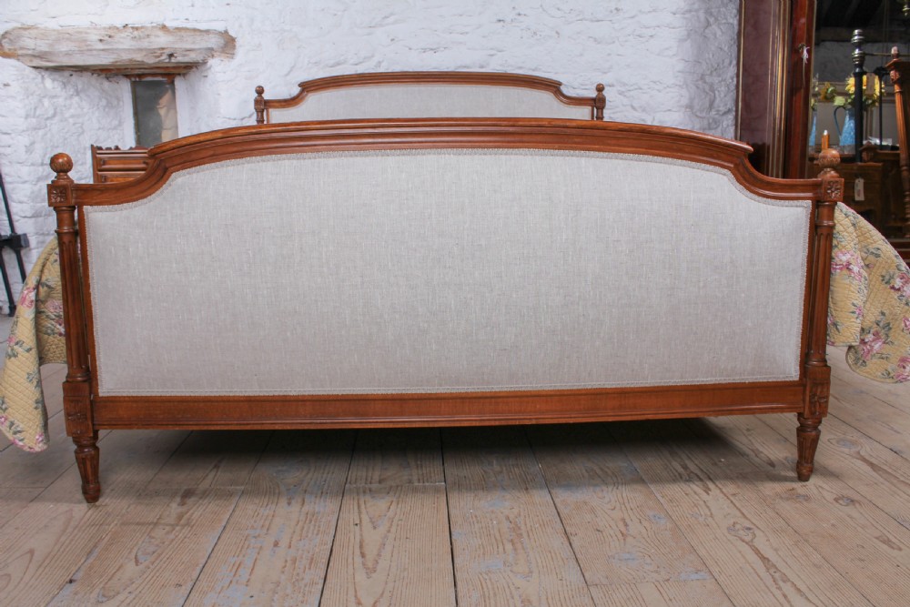 Newly upholstered walnut French Empire style king size bed View III