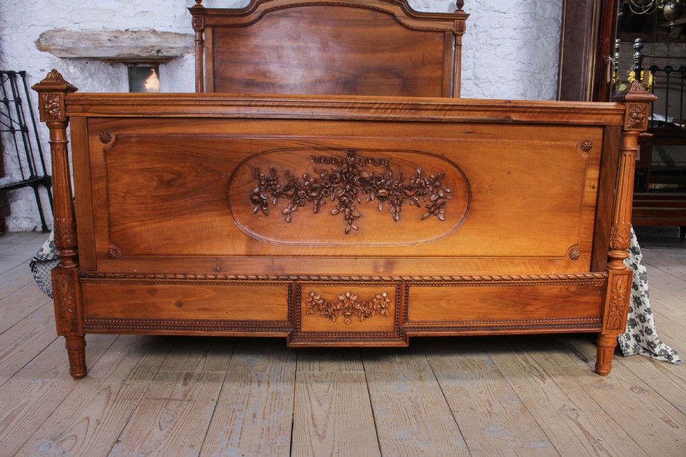 Impressive and beautiful large king size carved walnut bed and matching bedsides. View II