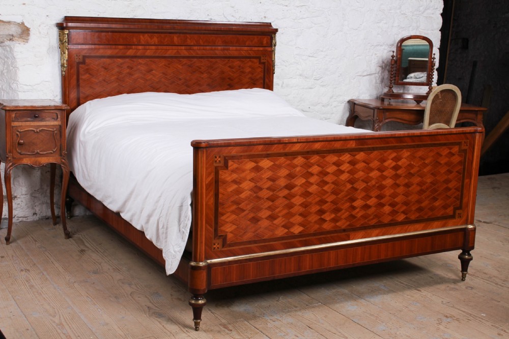 Very handsome mahogany and fruit wood parquetry king size bed