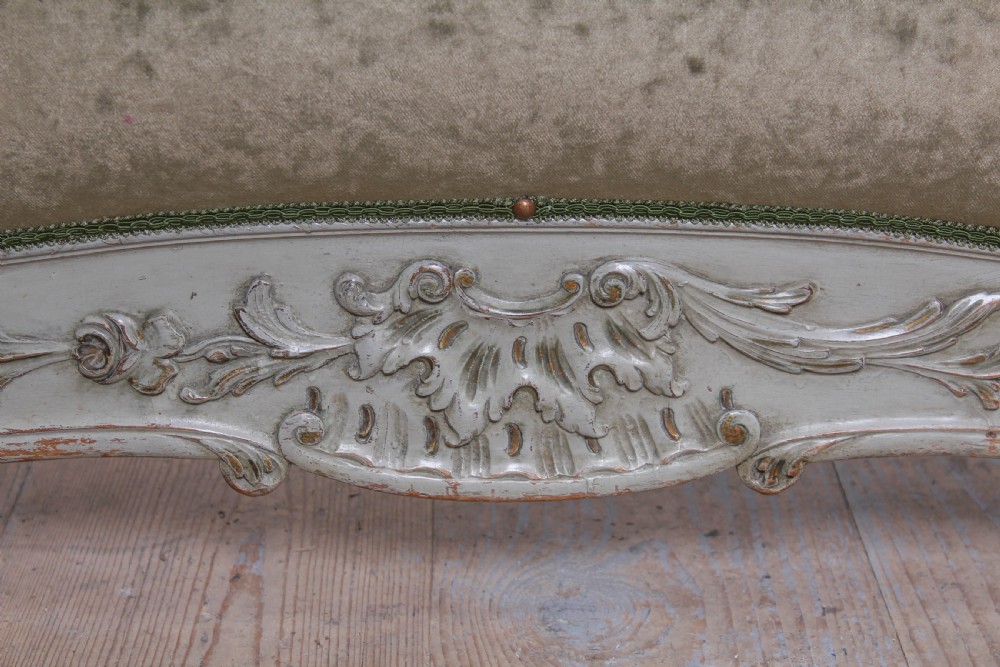 A pair of French Louis XV style single bed frames with carved grey painted timber and olive green velvet upholstered panels. View IV
