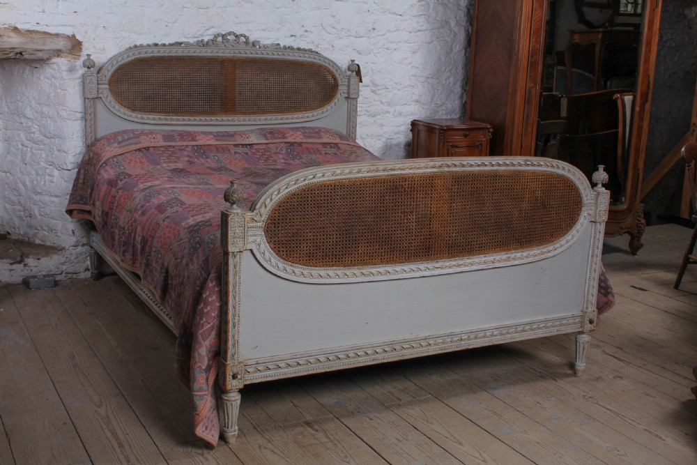 Fabulous French carved and caned king size bed