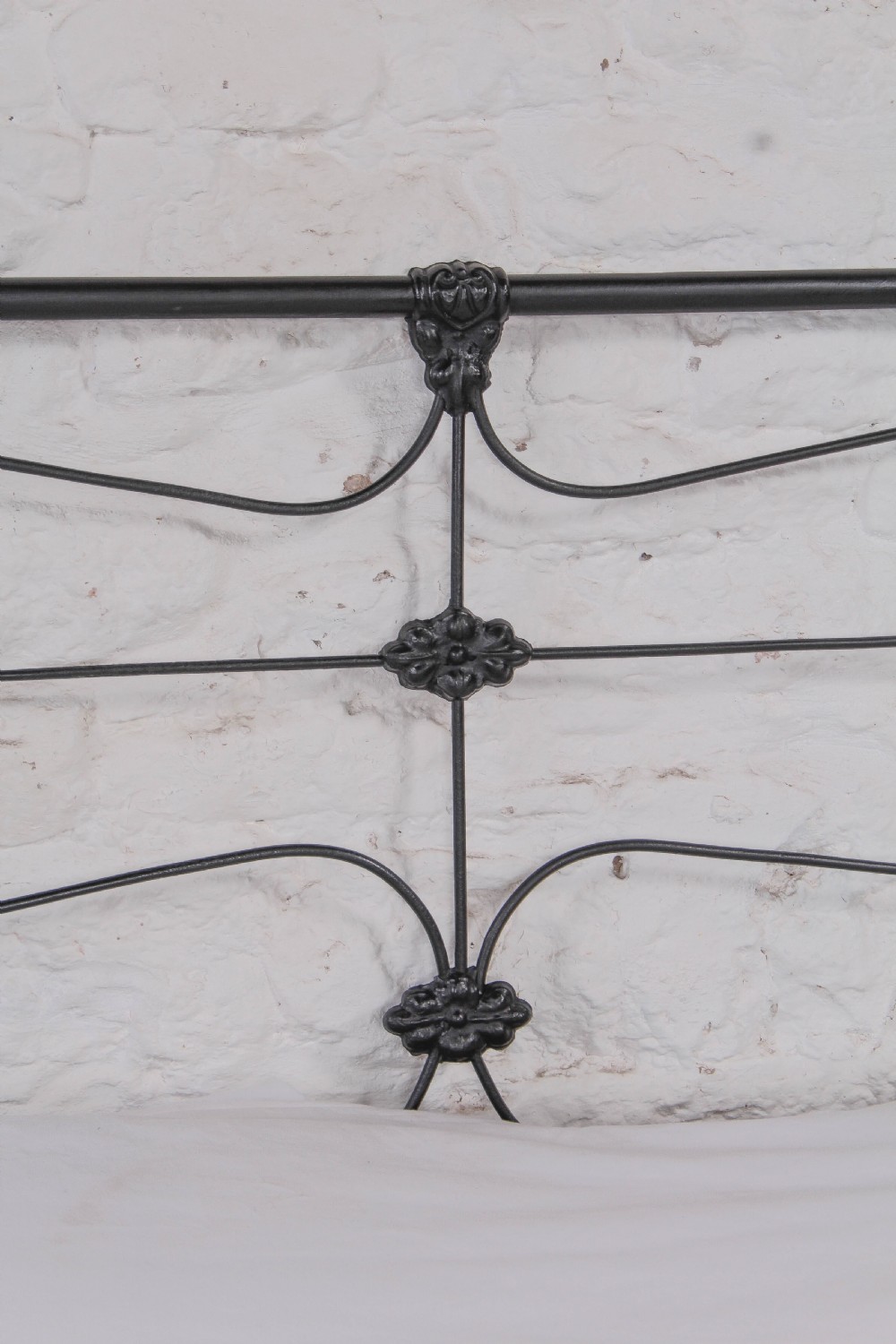 Pleasingly simple all iron king size nioend bed View V