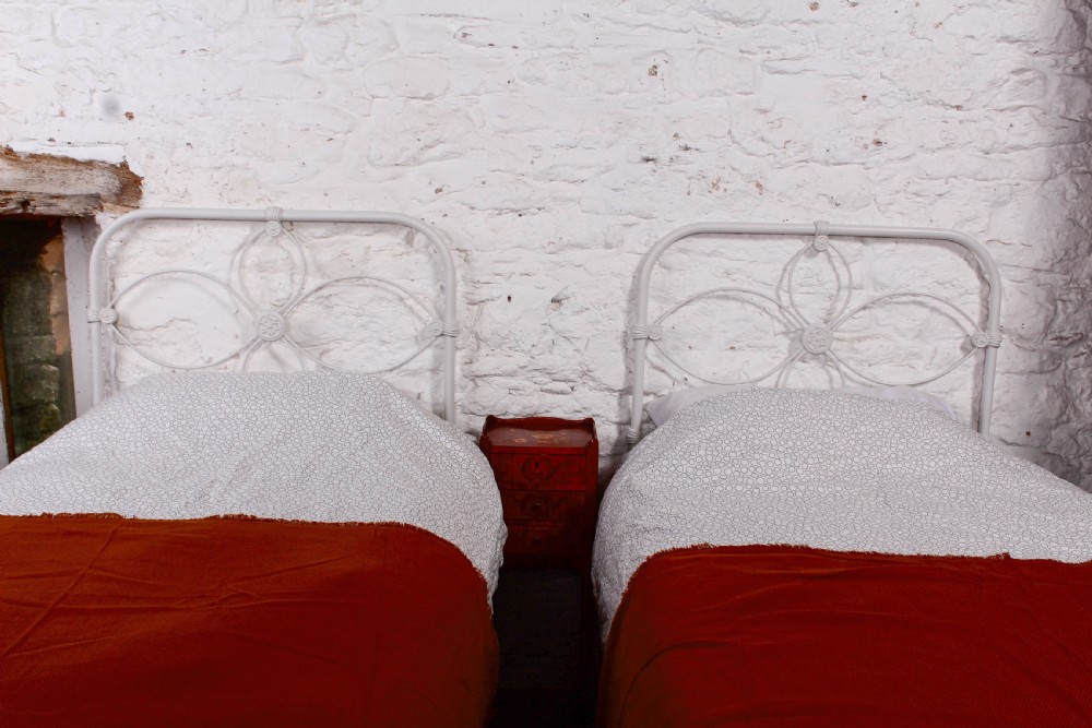 Pretty pair of Irish iron no end simple beds View V