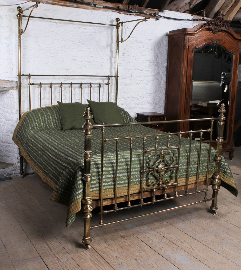 Spectacular Victorian king size all brass half tester bed.
