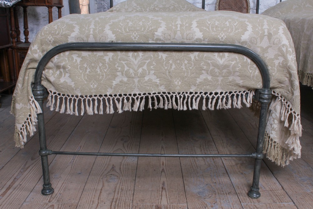 Lovely simple pair of utilitarian single iron beds View VI