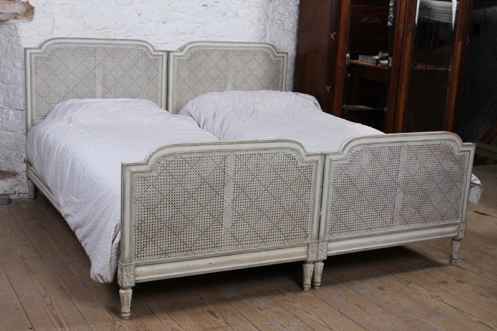 Pretty matching pair of French caned single  beds
