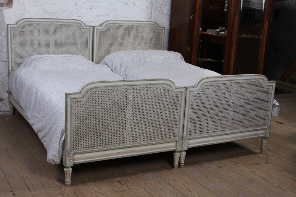 Pretty matching pair of French caned single  beds View II