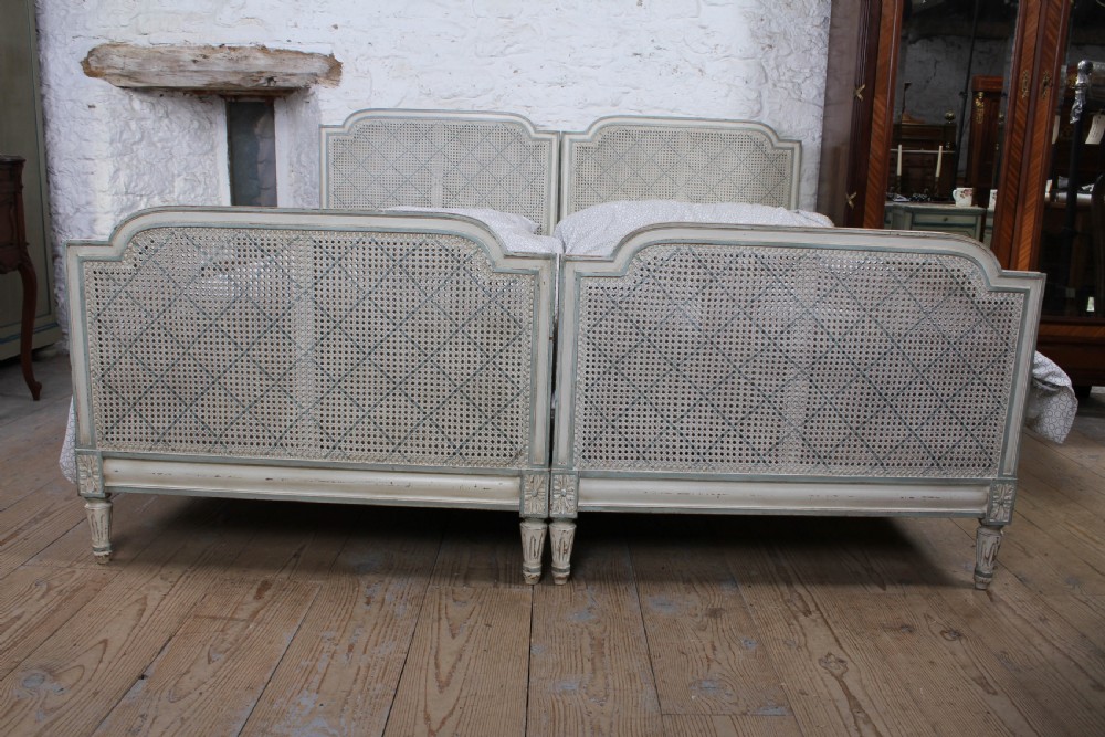 Pretty matching pair of French caned single  beds View IV