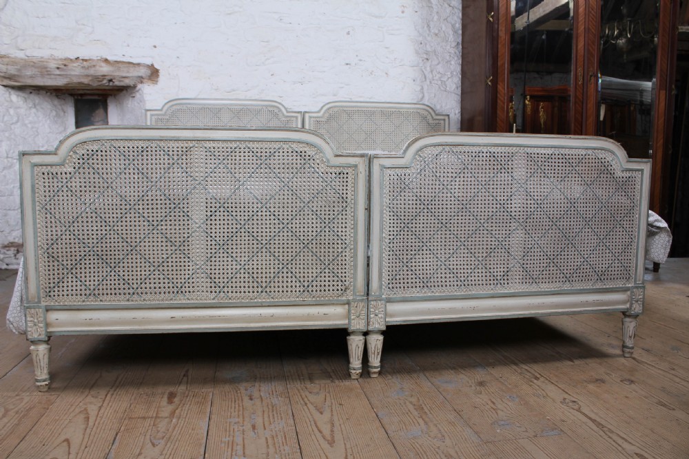 Pretty matching pair of French caned single  beds View X