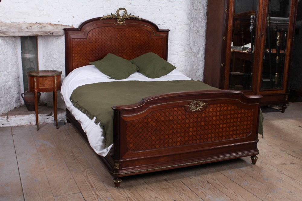 Handsome king size mahogany and fruitwood decorative bed