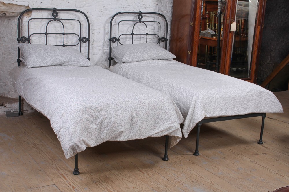 Lovely hand finished pair of iron single beds (can be joined) 