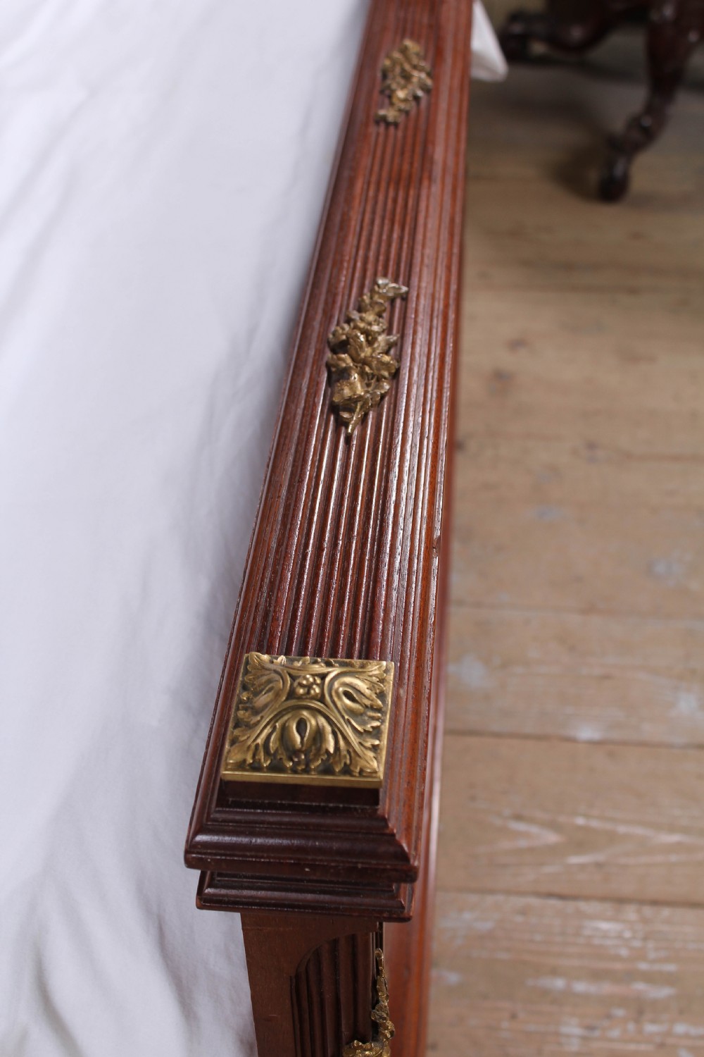 Magnificent mahogany and fruit wood parquetry king size bed with striking ormolu decoration. View V