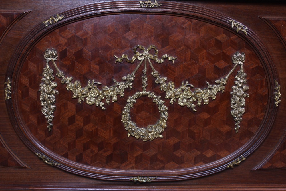 Magnificent mahogany and fruit wood parquetry king size bed with striking ormolu decoration. View VI