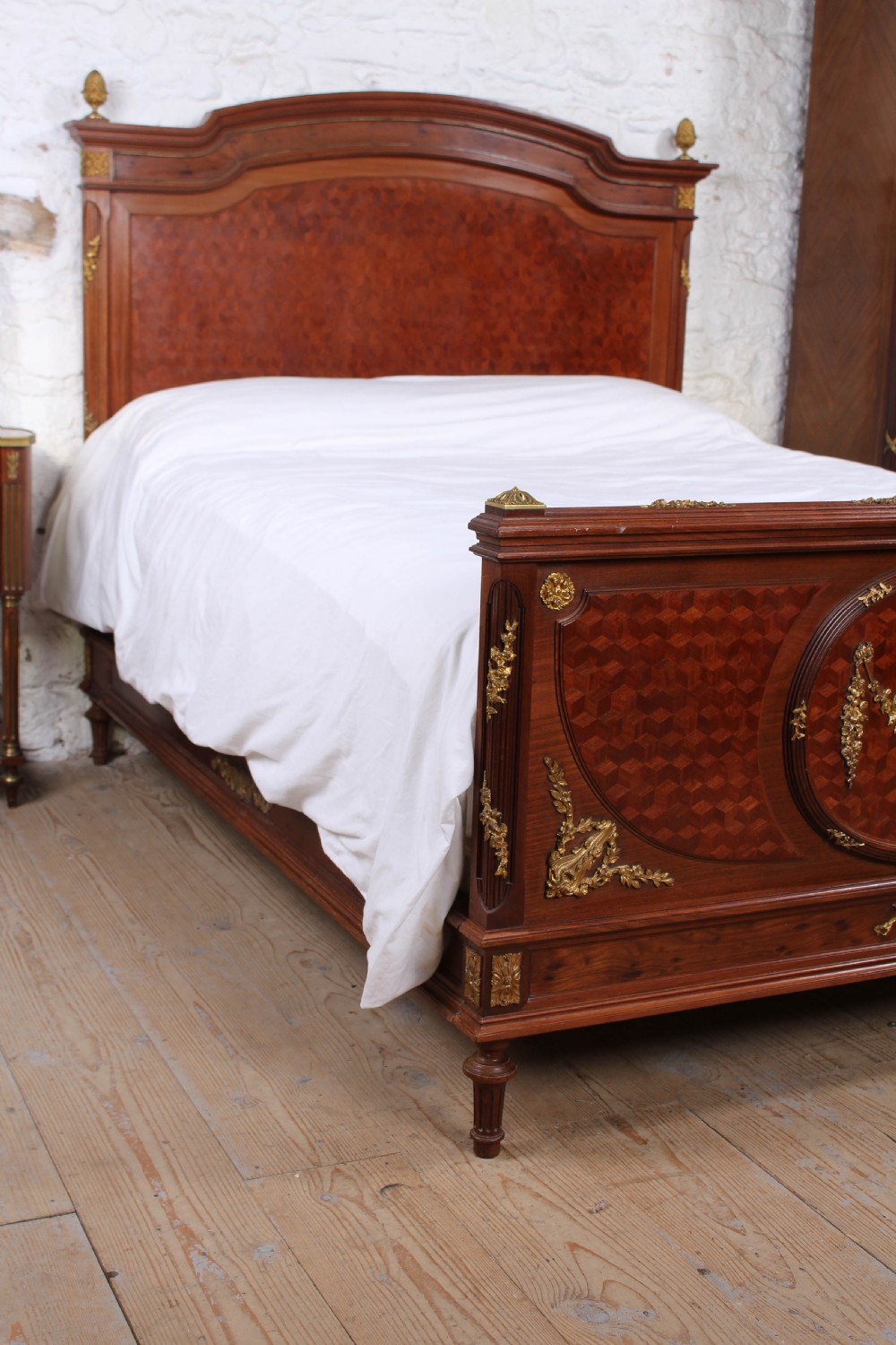 Magnificent mahogany and fruit wood parquetry king size bed with striking ormolu decoration. View VII