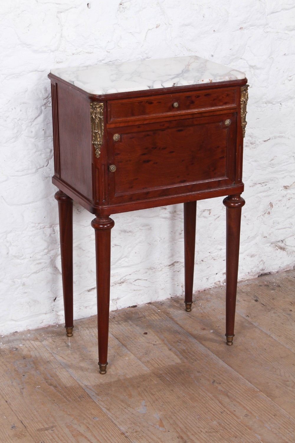 Plum mahogany bedside with white marble top