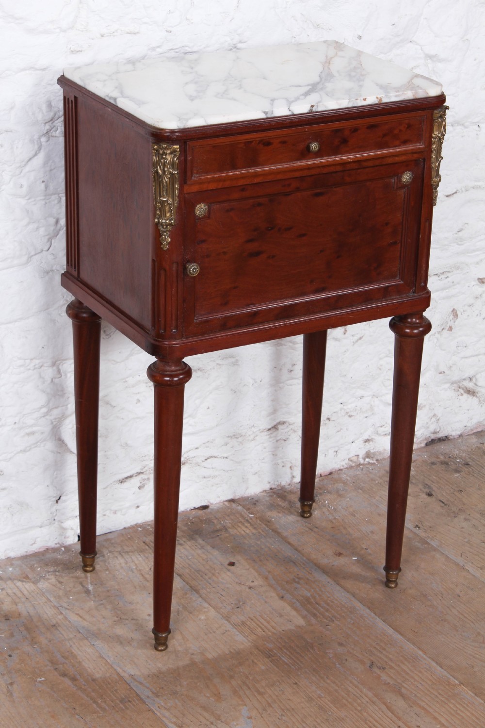 Plum mahogany bedside with white marble top View II