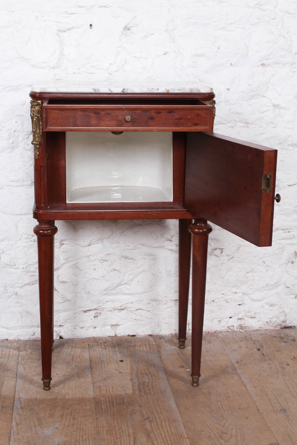 Plum mahogany bedside with white marble top View III
