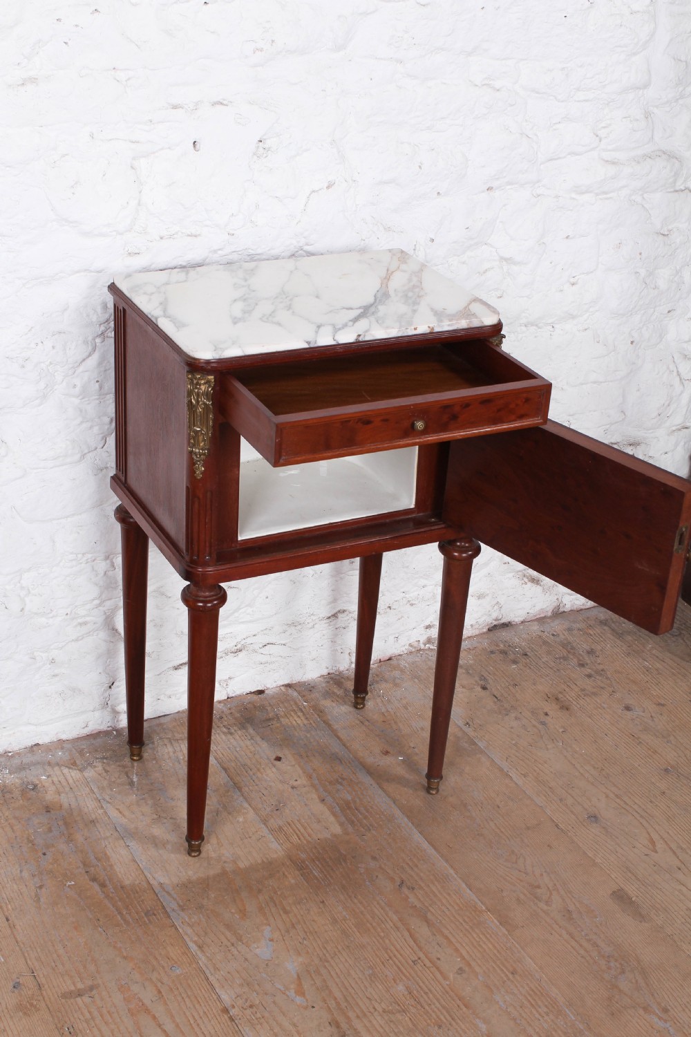 Plum mahogany bedside with white marble top View IV