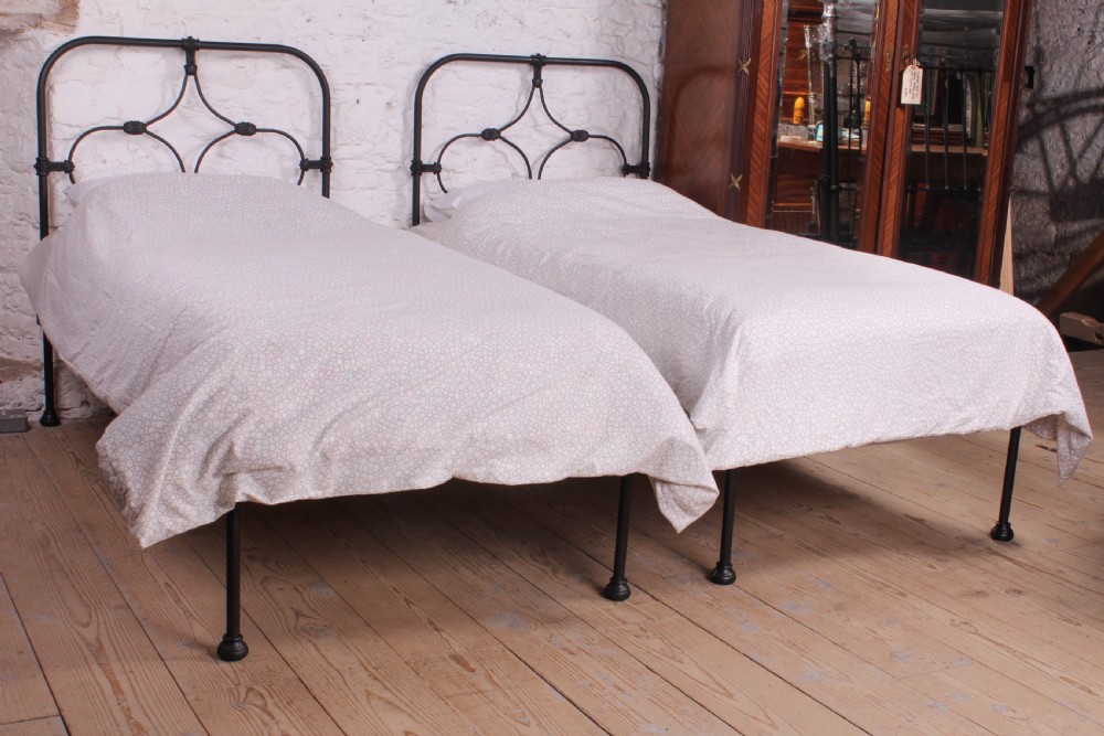 Lovely hand finished pair of iron single no end beds (can be joined)