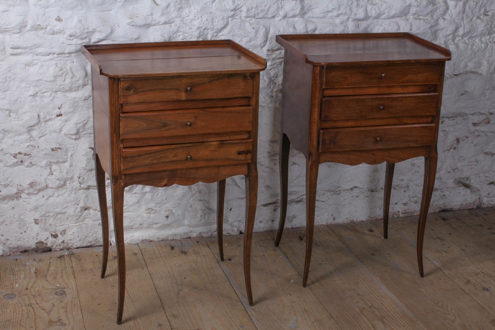 Simple pair of three drawer walnut bedsides