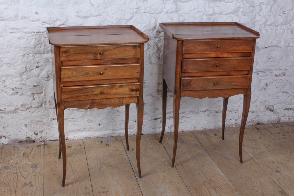 Simple pair of three drawer walnut bedsides View II