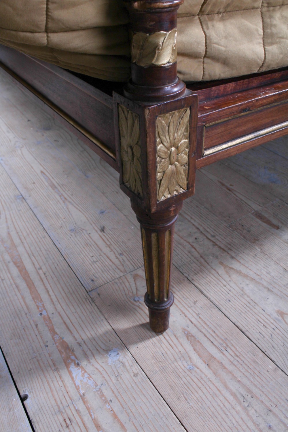 An antique mahogany super king bed featuring a high headboard with an oval central medallion, carved giltwood crest, Greek key motifs, and turned posts. View VIII